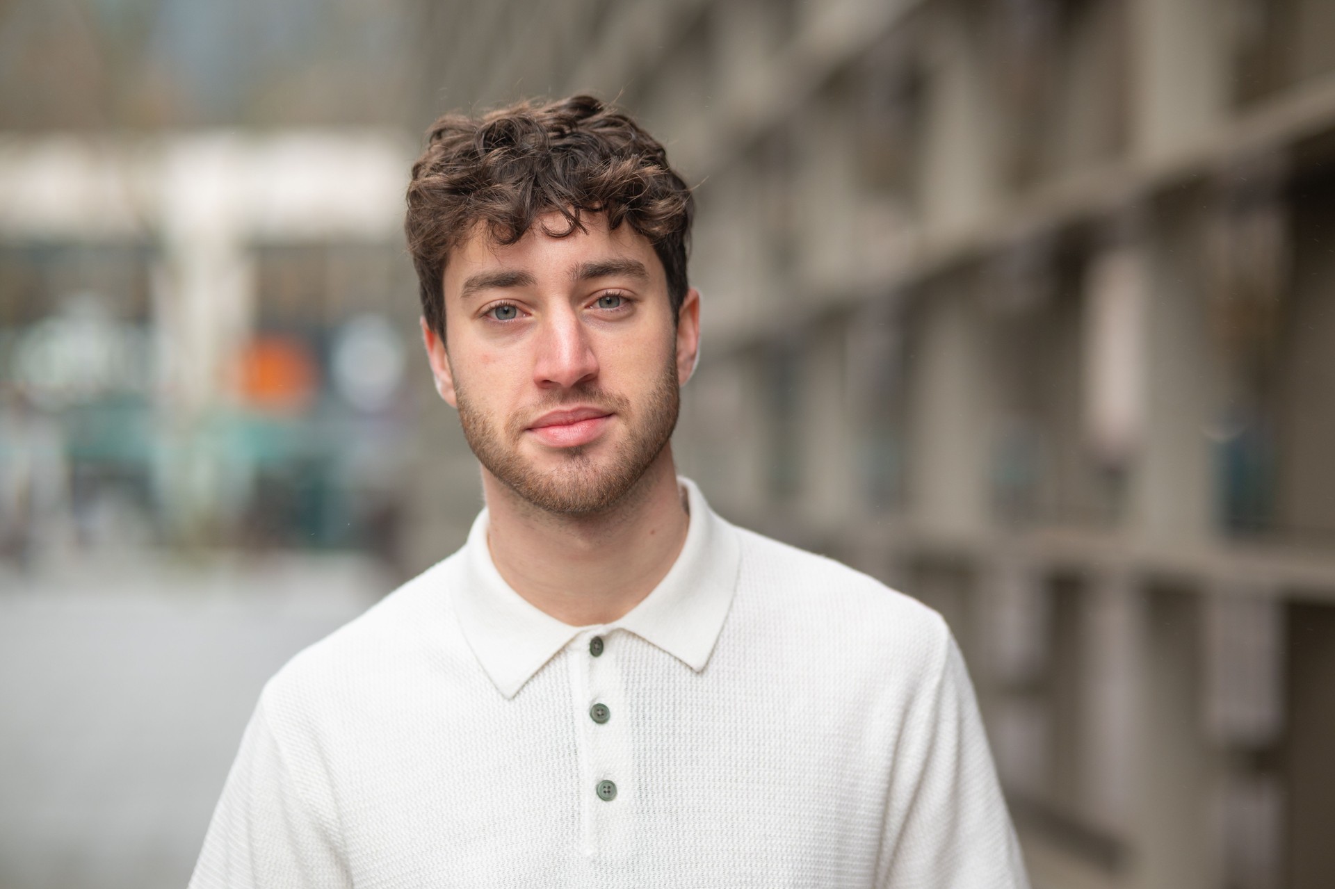 Portrait of a confident young man posing in an urban setting